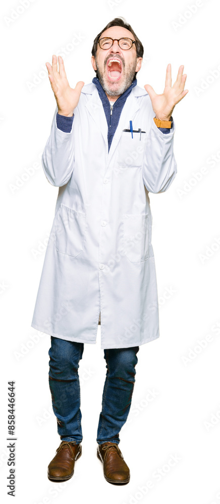 Middle age therapist wearing white coat crazy and mad shouting and yelling with aggressive expression and arms raised. Frustration concept. Middle age therapist wearing white coat crazy and mad shouting and yelling with aggressive expression and arms raised. Frustration concept.