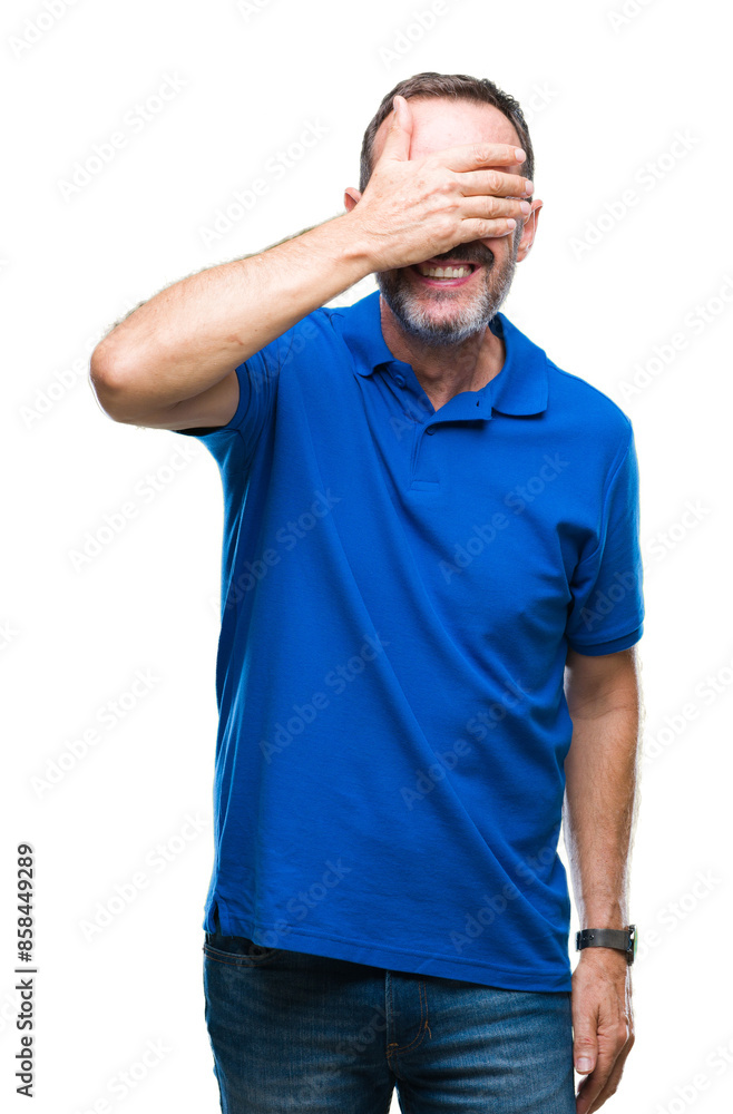 Middle age hoary senior man over isolated background smiling and laughing with hand on face covering eyes for surprise. Blind concept. Middle age hoary senior man over isolated background smiling and laughing with hand on face covering eyes for surprise. Blind concept.