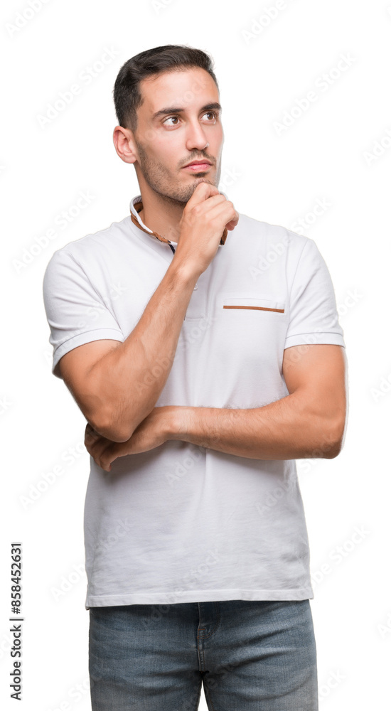 Handsome young casual man wearing white t-shirt serious face thinking about question, very confused idea Handsome young casual man wearing white t-shirt serious face thinking about question, very confused idea