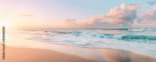 A serene beach sunrise background with soft pastel colors, gentle waves, and textured sand. The peaceful, picturesque view creates a relaxing, inspiring scene.