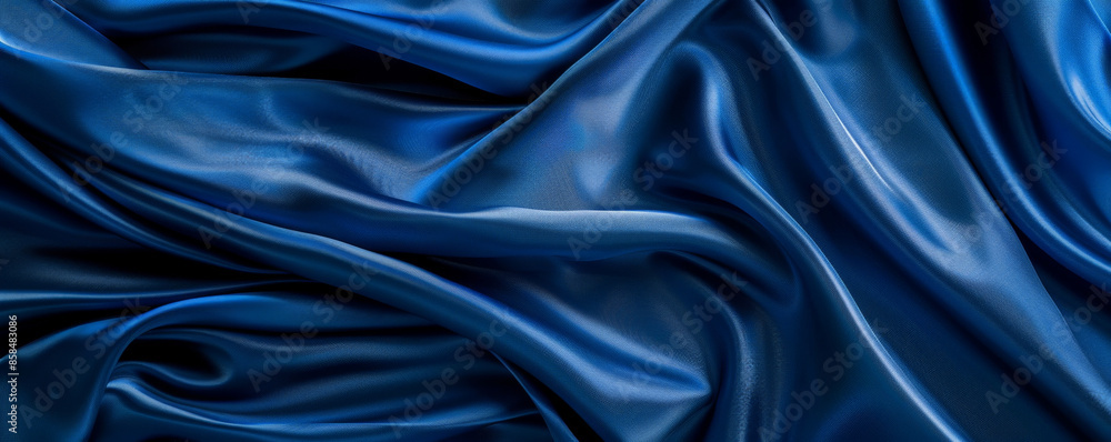 Elegant silk fabric background in a rich royal blue with a smooth, flowing texture. The luxurious fabric adds a touch of opulence and sophistication, perfect for high-end or romantic designs Elegant silk fabric background in a rich royal blue with a smooth, flowing texture. The luxurious fabric adds a touch of opulence and sophistication, perfect for high-end or romantic designs
