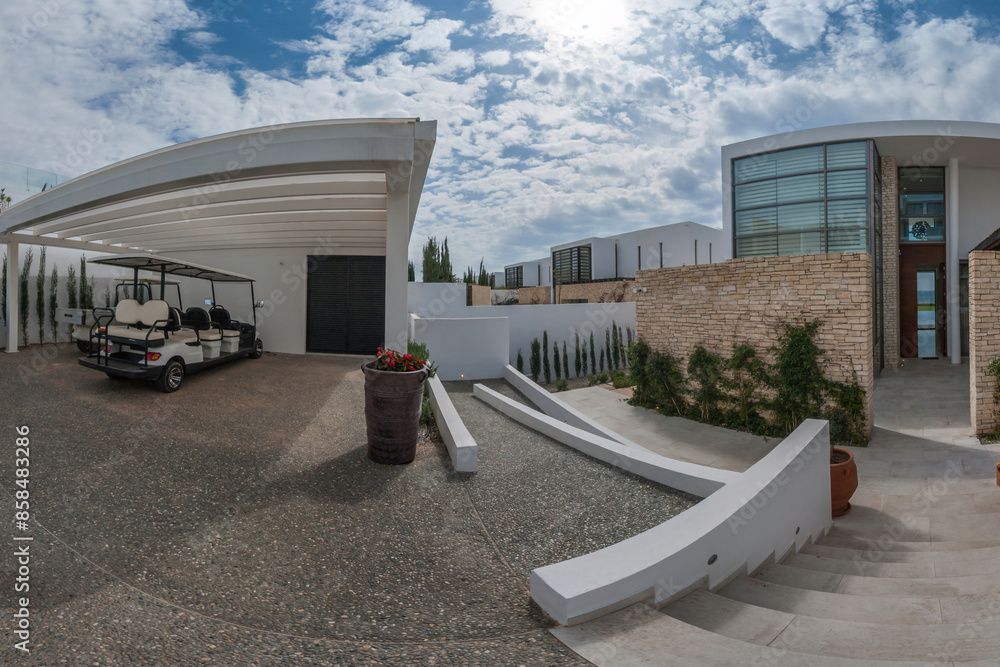 White Golf Cart Parked Under a Pergola at a Modern Villa in a Sunny ... - Off Grid Penthouse Condos With Golf Cart And Golf Buggy