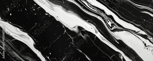 Marble abstract background featuring a sleek combination of black, silver, and white. The veins are sharp and bold, adding a touch of modern elegance photo