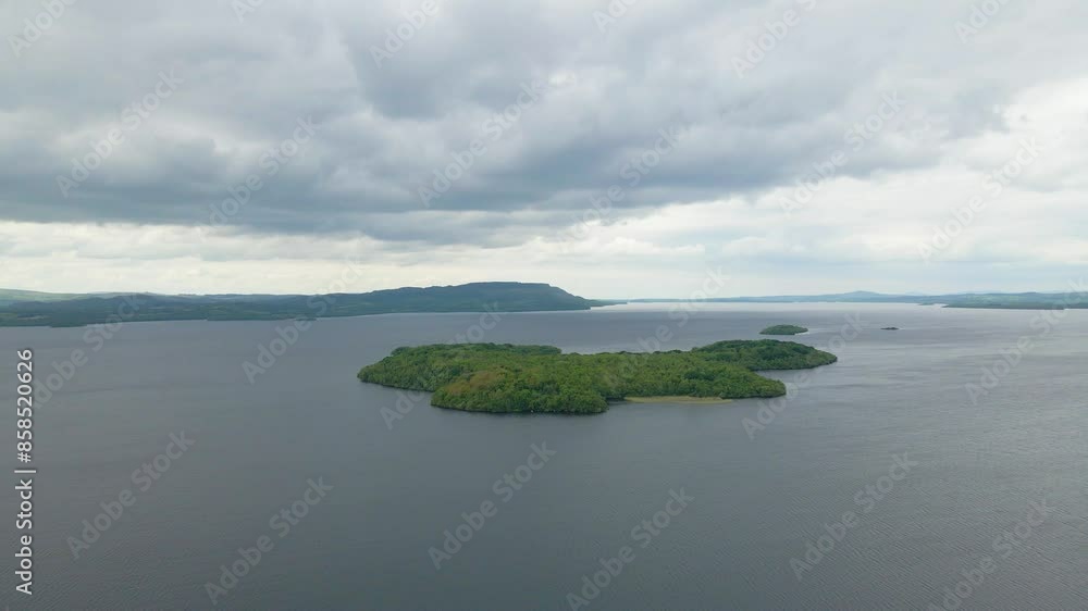 A drone moving towards a small green island in the middle of a lake. Lough Erne, Fermanagh, Northern Ireland A drone moving towards a small green island in the middle of a lake. Lough Erne, Fermanagh, Northern Ireland