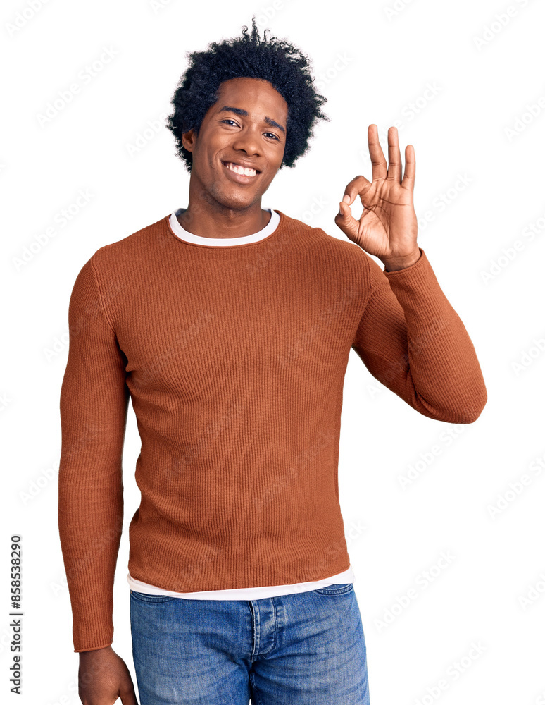 Handsome african american man with afro hair wearing casual clothes smiling positive doing ok sign with hand and fingers. successful expression.