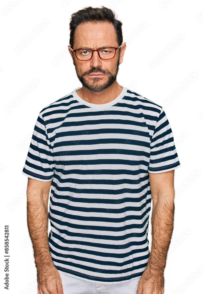 Middle age man wearing casual clothes and glasses depressed and worry for distress, crying angry and afraid. sad expression. Middle age man wearing casual clothes and glasses depressed and worry for distress, crying angry and afraid. sad expression.