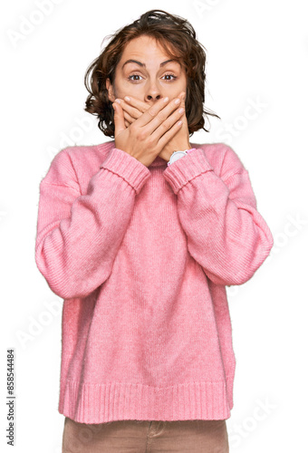 Young hispanic woman wearing casual clothes shocked covering mouth with hands for mistake. secret concept.