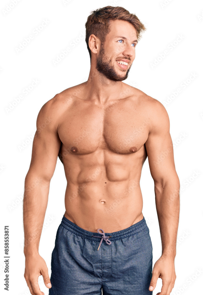 Young caucasian man standing shirtless looking away to side with smile on face, natural expression. laughing confident. Young caucasian man standing shirtless looking away to side with smile on face, natural expression. laughing confident.