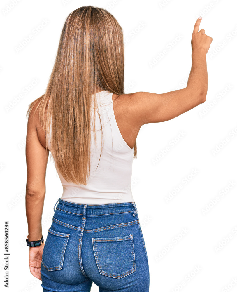 Young blonde woman wearing casual style with sleeveless shirt posing backwards pointing ahead with finger hand Young blonde woman wearing casual style with sleeveless shirt posing backwards pointing ahead with finger hand