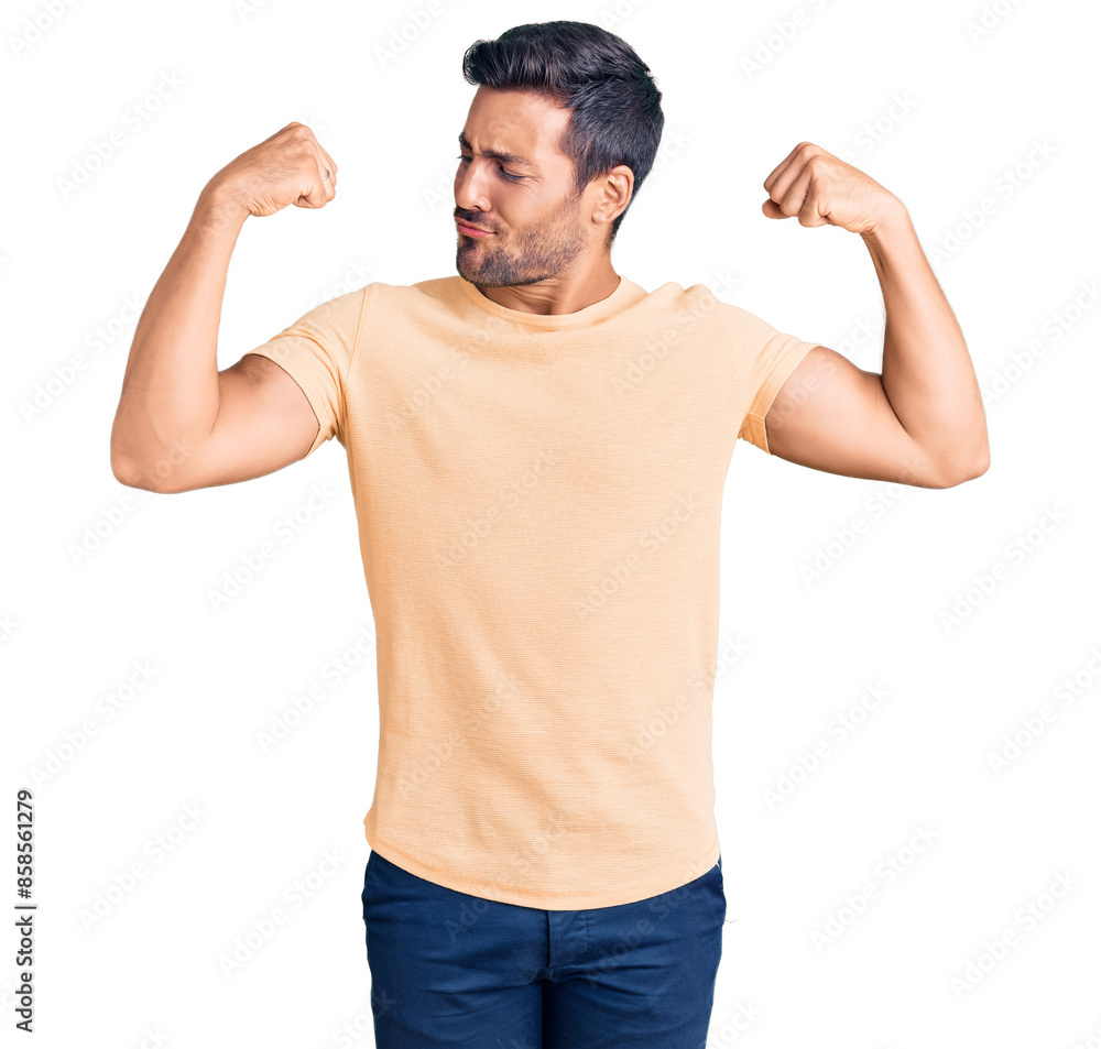 Young hispanic man wearing casual clothes showing arms muscles smiling proud. fitness concept.