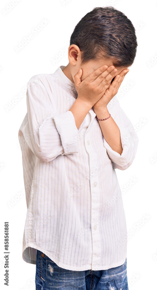 Cute blond kid wearing elegant shirt with sad expression covering face with hands while crying. depression concept. Cute blond kid wearing elegant shirt with sad expression covering face with hands while crying. depression concept.