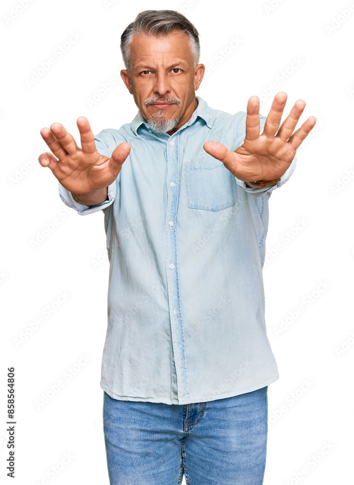 Middle age grey-haired man wearing casual clothes doing stop gesture with hands palms, angry and frustration expression Middle age grey-haired man wearing casual clothes doing stop gesture with hands palms, angry and frustration expression
