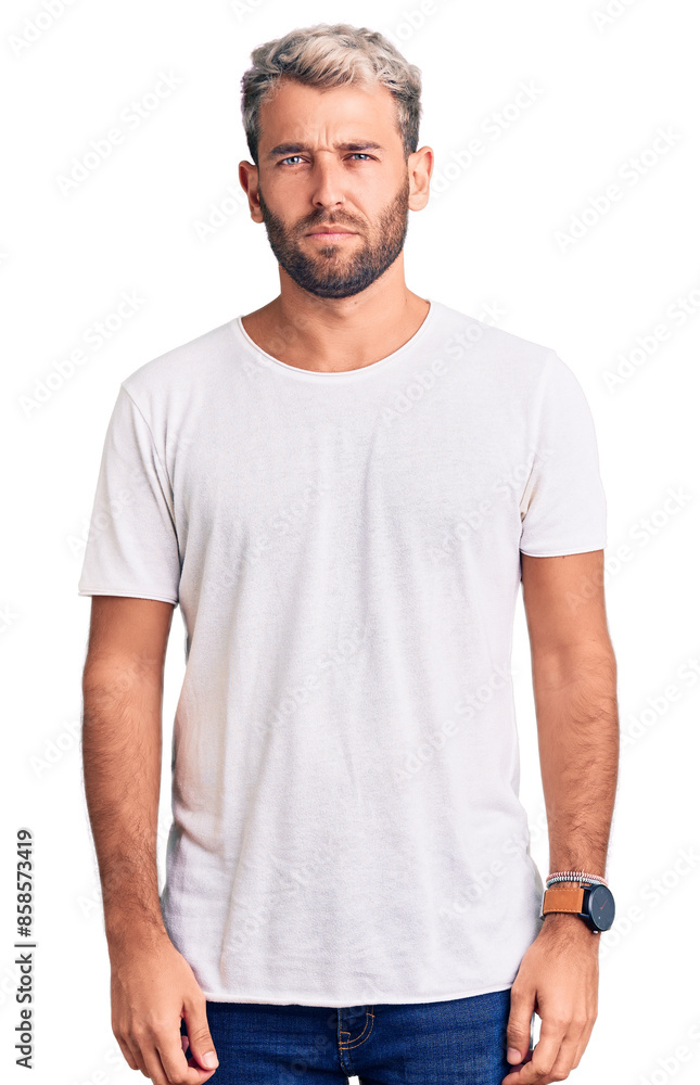 Young handsome blond man wearing casual t-shirt depressed and worry for distress, crying angry and afraid. sad expression. Young handsome blond man wearing casual t-shirt depressed and worry for distress, crying angry and afraid. sad expression.