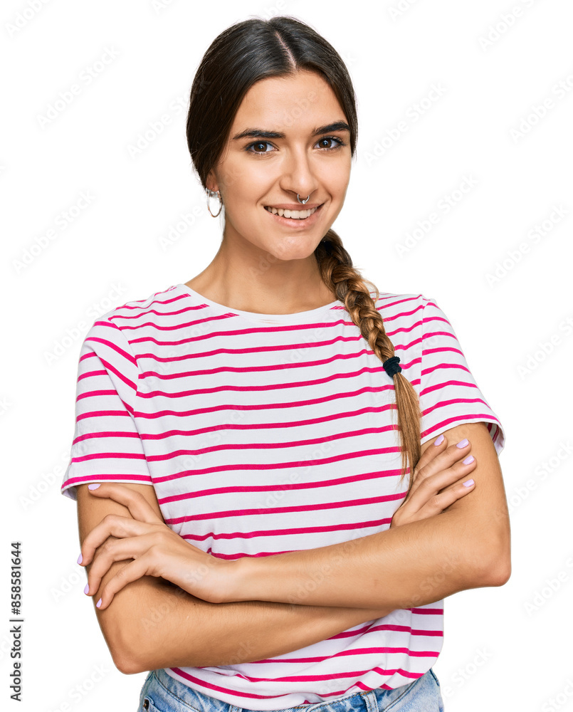 Young hispanic woman wearing casual clothes happy face smiling with crossed arms looking at the camera. positive person. Young hispanic woman wearing casual clothes happy face smiling with crossed arms looking at the camera. positive person.