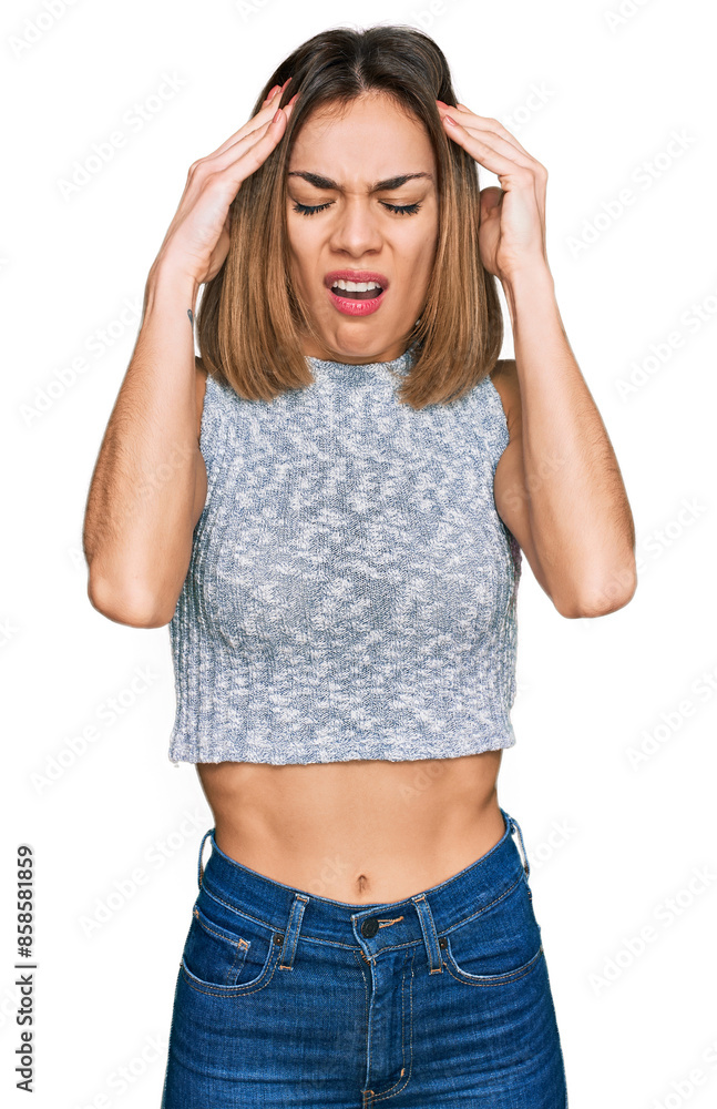 Young blonde girl wearing casual style with sleeveless shirt suffering from headache desperate and stressed because pain and migraine. hands on head. Young blonde girl wearing casual style with sleeveless shirt suffering from headache desperate and stressed because pain and migraine. hands on head.