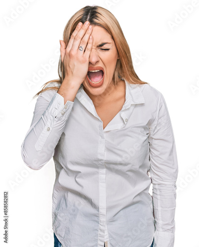 Young caucasian woman wearing casual clothes yawning tired covering half face, eye and mouth with hand. face hurts in pain.