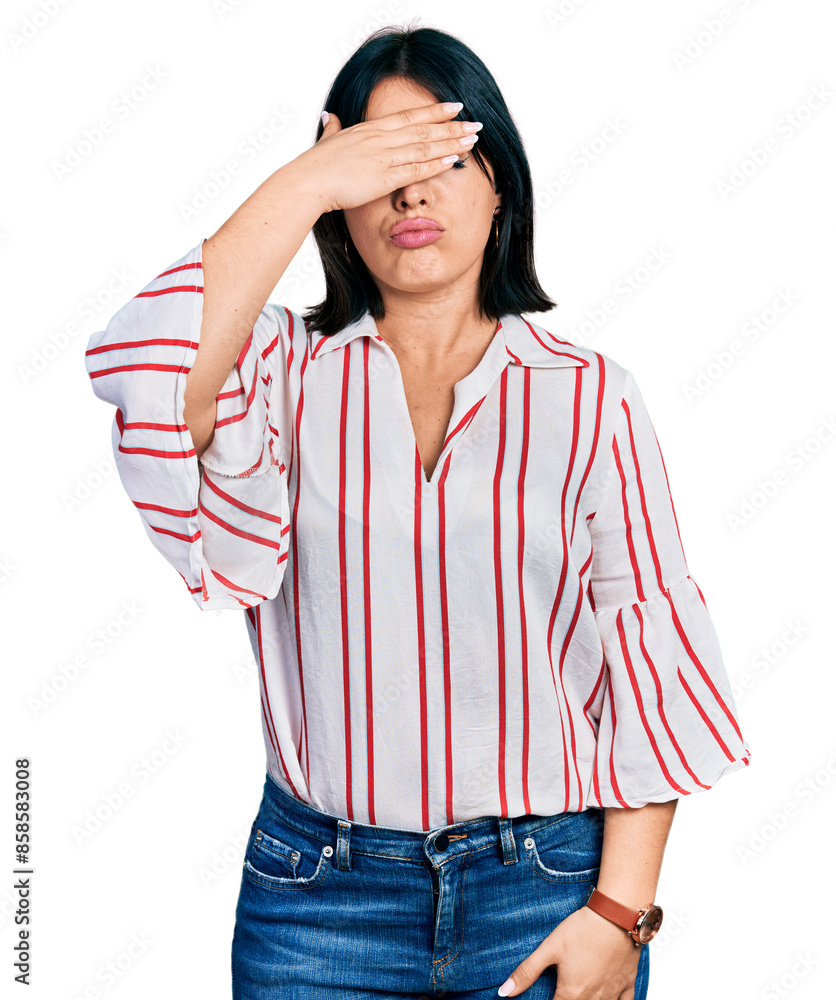Φωτογραφία Young hispanic girl wearing casual clothes covering eyes with hand, looking serious and sad