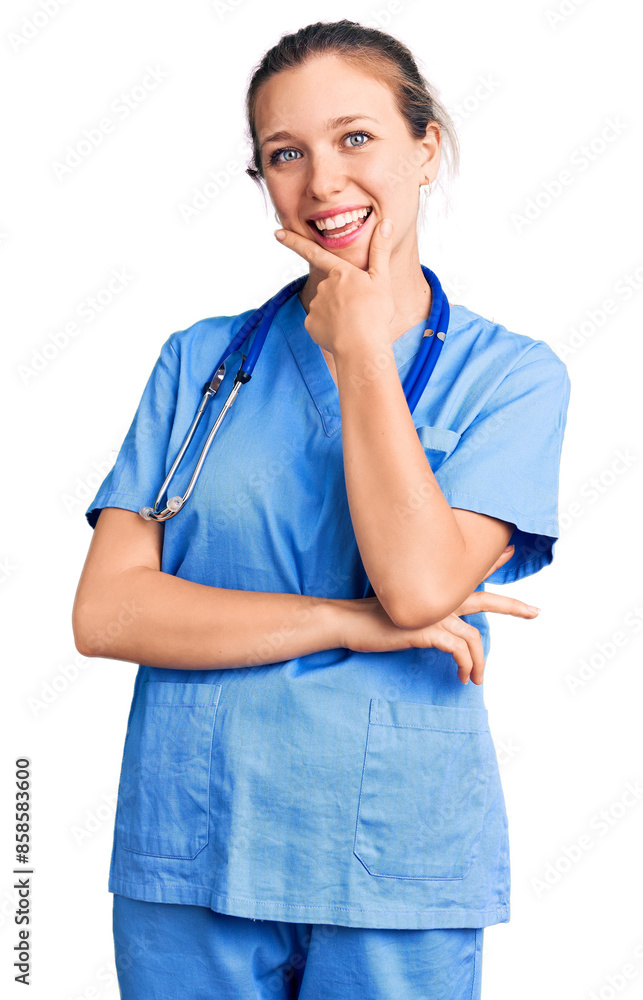 Young beautiful blonde woman wearing doctor uniform and stethoscope looking confident at the camera smiling with crossed arms and hand raised on chin. thinking positive. Young beautiful blonde woman wearing doctor uniform and stethoscope looking confident at the camera smiling with crossed arms and hand raised on chin. thinking positive.