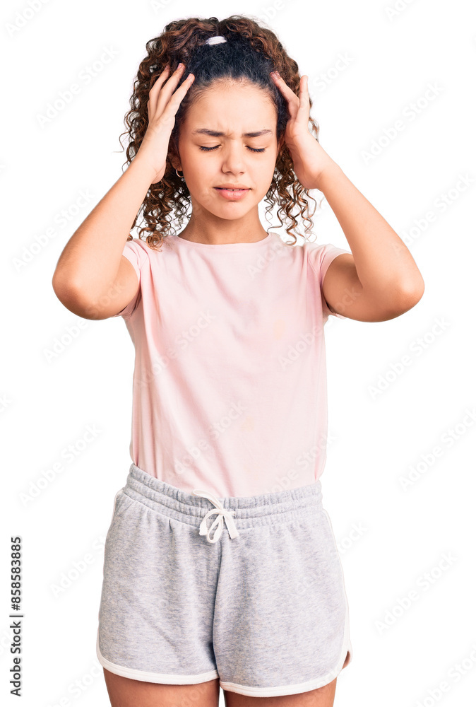 Beautiful kid girl with curly hair wearing casual clothes suffering from headache desperate and stressed because pain and migraine. hands on head. Beautiful kid girl with curly hair wearing casual clothes suffering from headache desperate and stressed because pain and migraine. hands on head.