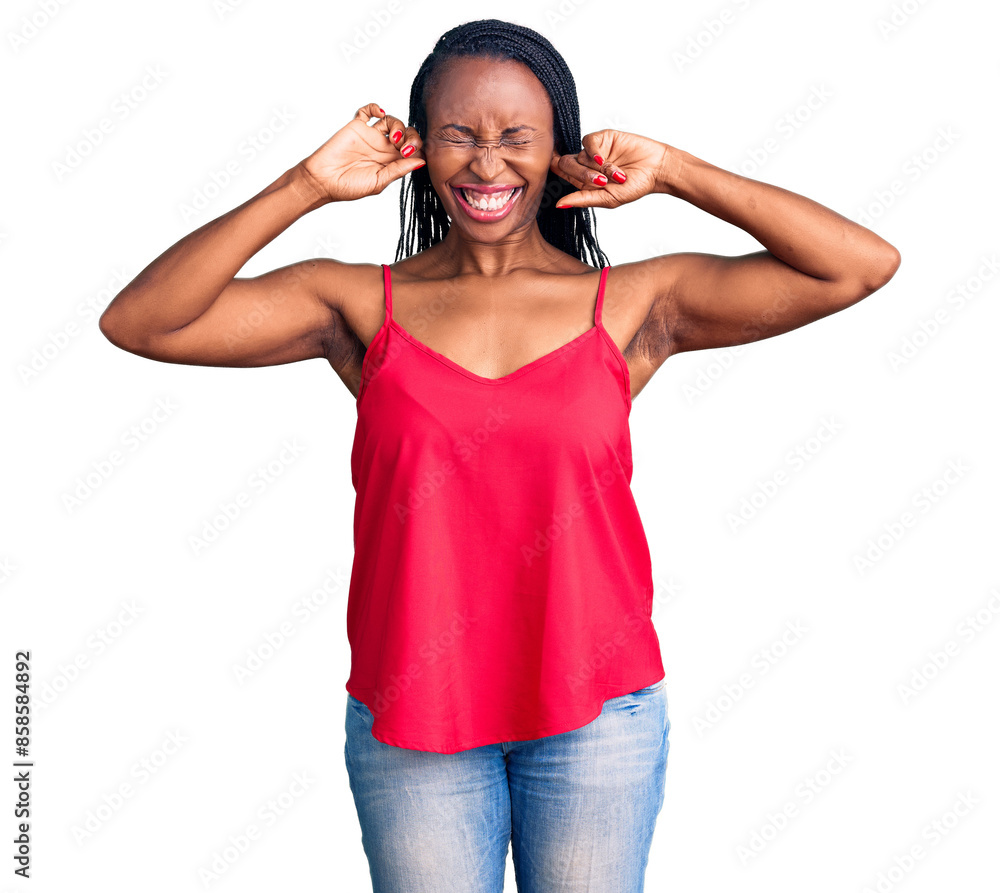 Young african american woman wearing casual clothes covering ears with fingers with annoyed expression for the noise of loud music. deaf concept. Young african american woman wearing casual clothes covering ears with fingers with annoyed expression for the noise of loud music. deaf concept.