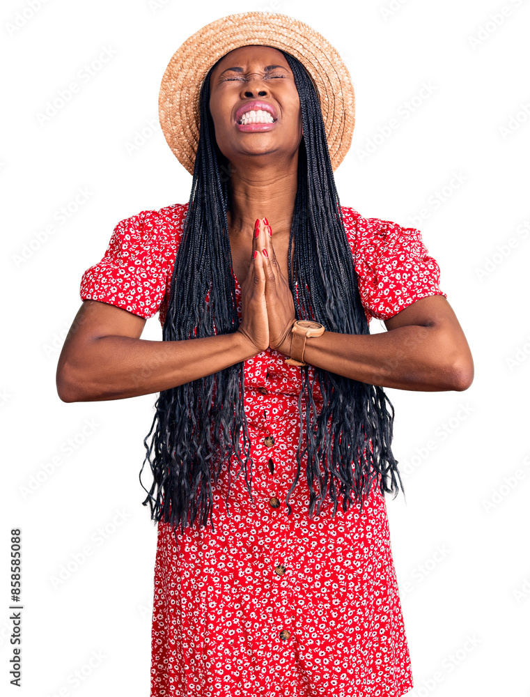 Φωτογραφία Young african american woman wearing summer hat begging and praying with hands together with hope expression on face very emotional and worried
