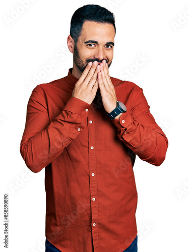 Obraz na płótnie Young hispanic man with beard wearing casual shirt laughing and embarrassed gigg
