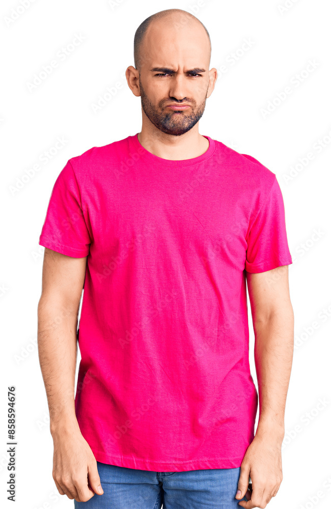 Fototapeta premium Young handsome man wearing casual t shirt depressed and worry for distress, crying angry and afraid. sad expression.