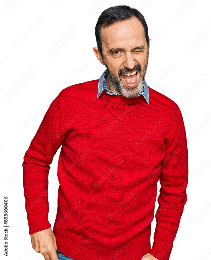 Middle age hispanic man wearing casual clothes winking looking at the camera with sexy expression, cheerful and happy face. Middle age hispanic man wearing casual clothes winking looking at the camera with sexy expression, cheerful and happy face.