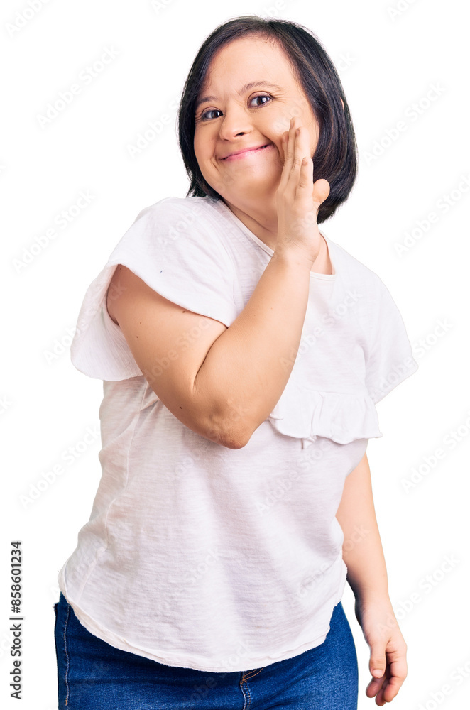 Brunette woman with down syndrome wearing casual white tshirt hand on mouth telling secret rumor, whispering malicious talk conversation Brunette woman with down syndrome wearing casual white tshirt hand on mouth telling secret rumor, whispering malicious talk conversation