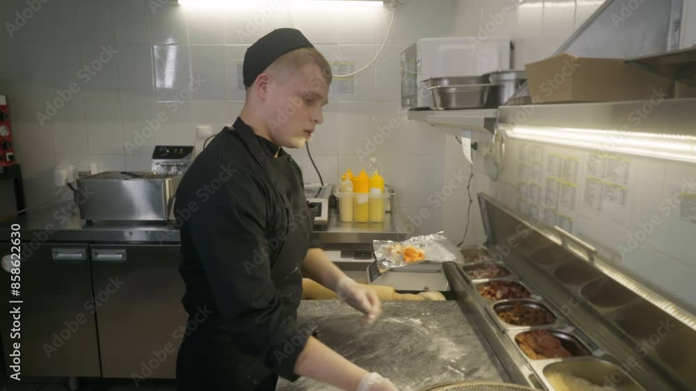 Young Gourmet Cook Prepares Dough For Pizza Making At Restaurant Kitchen. Chef Handles Skillful Kneading Of Tasty Pizza Dough Ingredient. Delicious Italian Cuisine Pizza Dough. Traditional Recipe Young Gourmet Cook Prepares Dough For Pizza Making At Restaurant Kitchen. Chef Handles Skillful Kneading Of Tasty Pizza Dough Ingredient. Delicious Italian Cuisine Pizza Dough. Traditional Recipe