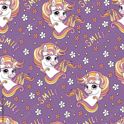 Seamless unicorns heads pattern on a purple background