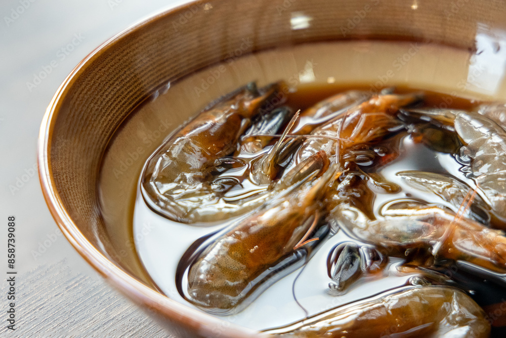 Fototapeta premium Close-up of Teochew Marinated Raw Shrimp on the table, Chinese food