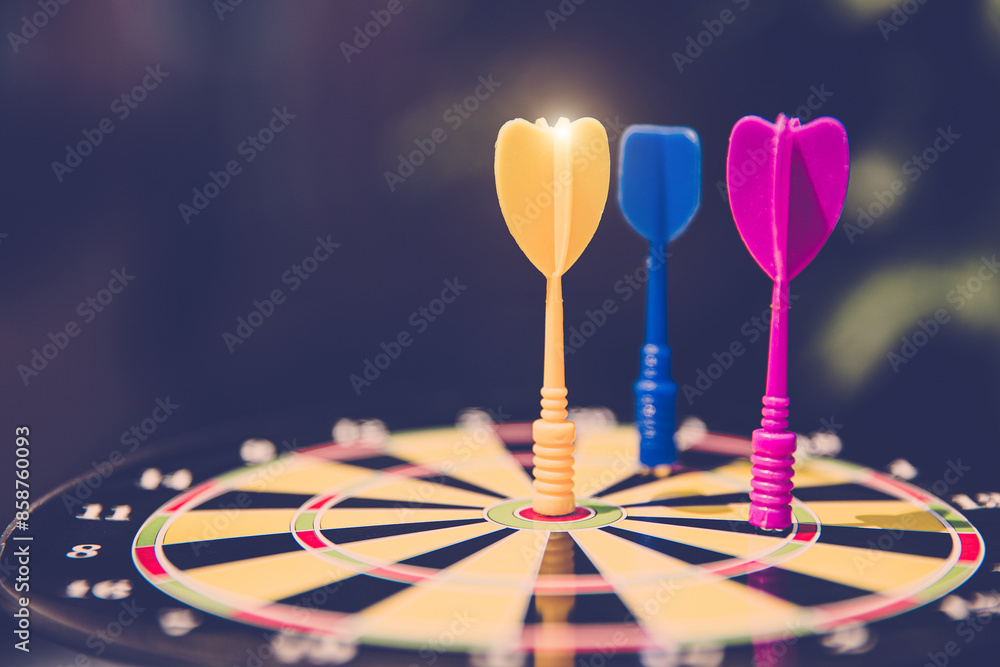 Bullseye target goal or dartboard has dart arrow throw hitting center shooting for financial business targeting planning to winner concept. Bullseye target goal or dartboard has dart arrow throw hitting center shooting for financial business targeting planning to winner concept.