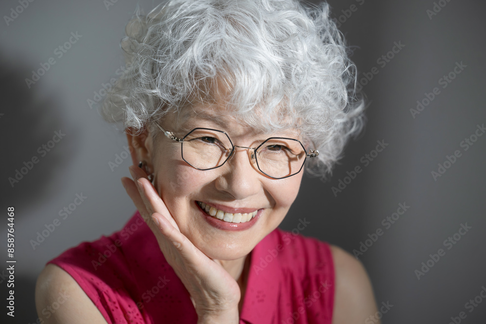 Close-up of woman with gray hair looking up Skin care and beauty image Touching cheeks Close-up of woman with gray hair looking up Skin care and beauty image Touching cheeks