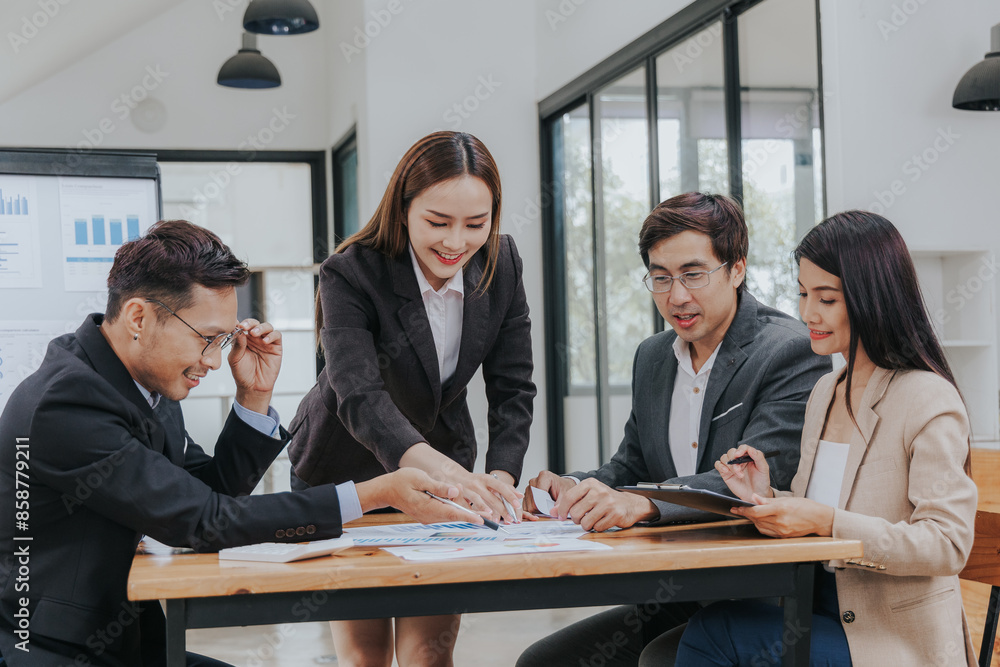 Professional team, including businessmen and businesswomen, engages in a strategy meeting. They discuss marketing, analyze financial data, and brainstorm investment plans using charts, graphs, Professional team, including businessmen and businesswomen, engages in a strategy meeting. They discuss marketing, analyze financial data, and brainstorm investment plans using charts, graphs,