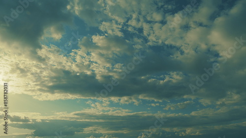 Bright Blue Sky And Sun Flare In Spring Sky With Clouds Vapor. Sun Shining With Clouds. © artifex.orlova