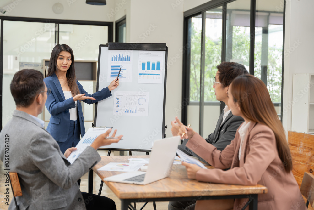 Asian Business Group Chat about graph work Present in meetings, in the office Asian Business Group Chat about graph work Present in meetings, in the office