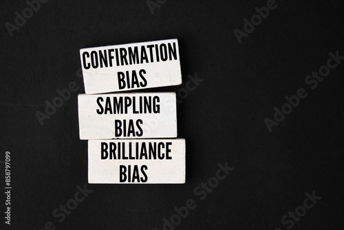White wood with the three words Confirmation Bias, Sampling Bias, and Brilliance Bias. White wood with the three words Confirmation Bias, Sampling Bias, and Brilliance Bias. Three types of bias can be