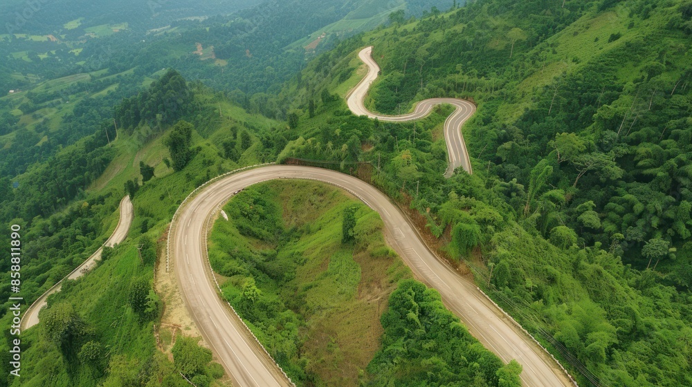 Aerial View of a Winding Road Through Lush Green Mountains Aerial View of a Winding Road Through Lush Green Mountains