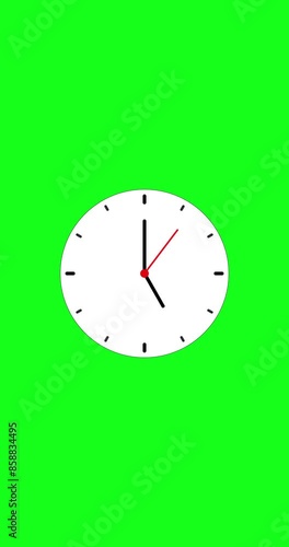 Clock icon, and moving arrow rotted on the green background. analog wall clock animation with green screen background vertical for phone, 12h loop. Clock icon animation with key color. Chroma color.