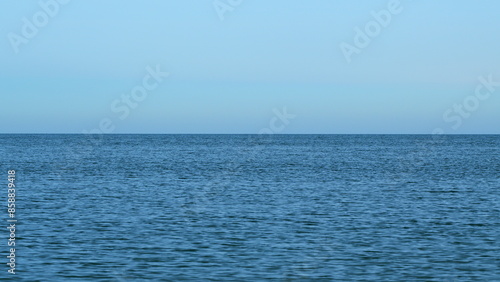 Quiet Seascape Texture With Small Wave And Clear Blue Sky. Wonderful View From The Sea. Still.