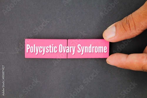 pink stick with the word polycystic ovary syndrome. the concept of women's disease photo