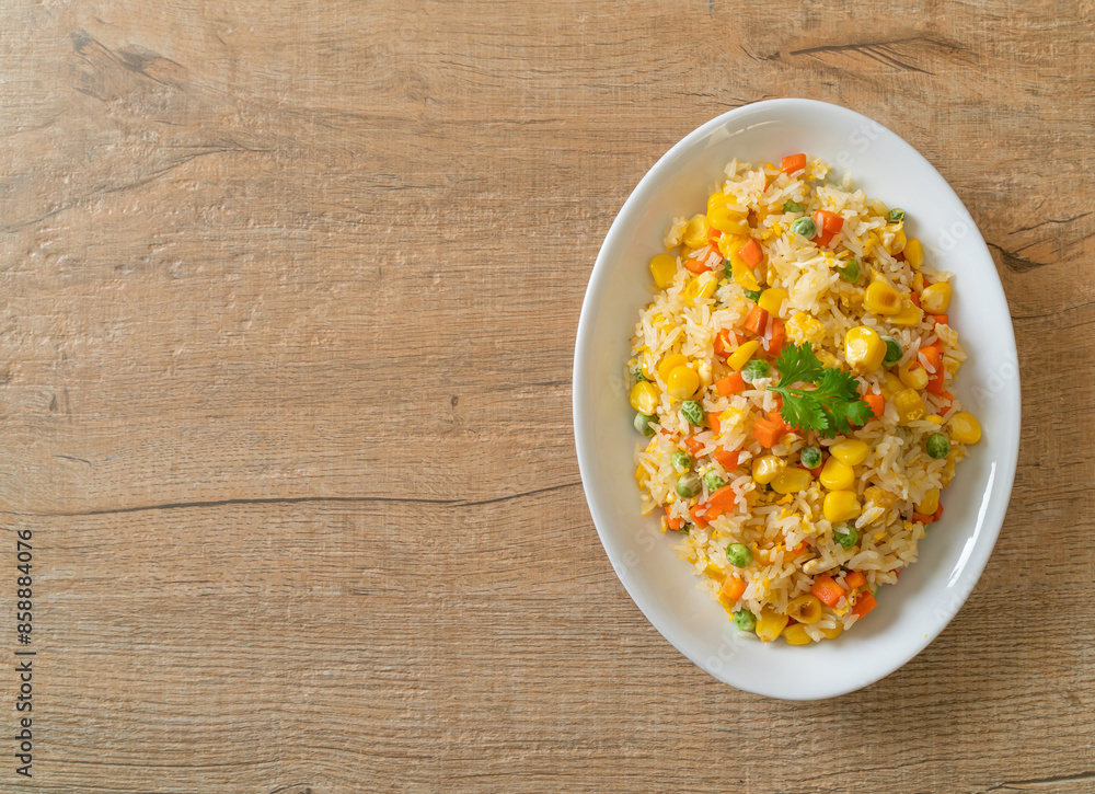 fried rice with mixed vegetable (carrot, green bean peas, corn) and egg fried rice with mixed vegetable (carrot, green bean peas, corn) and egg