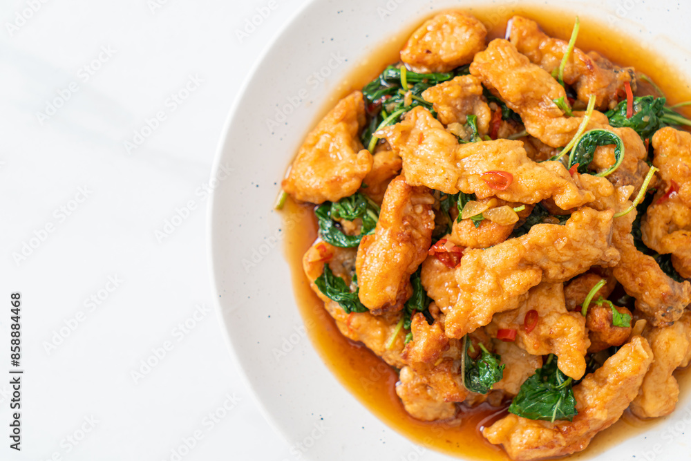 stir-fried fried fish with basil and chili in thai style