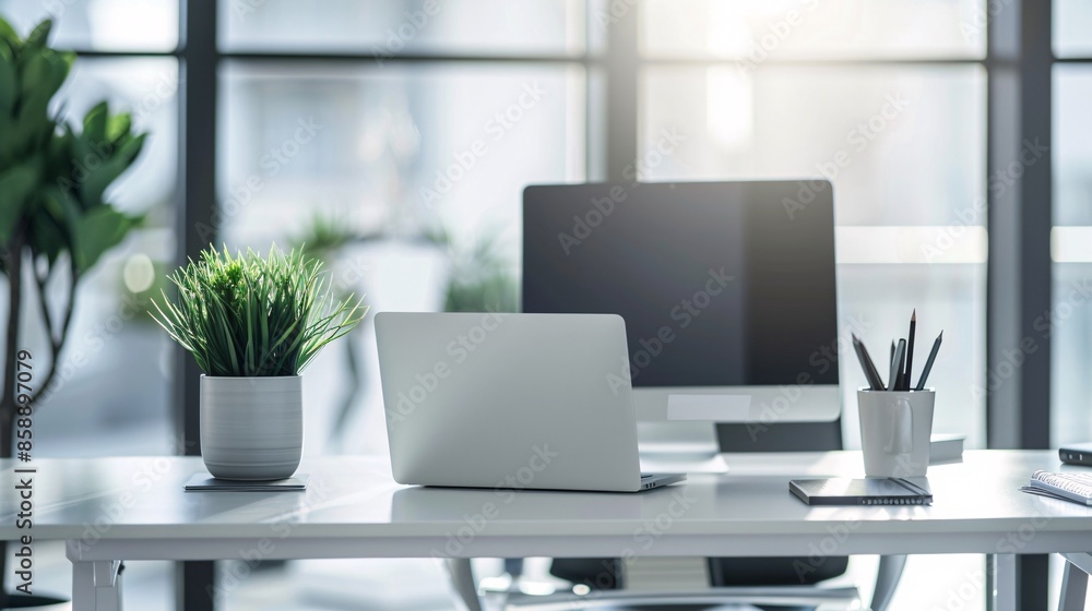A modern office scene featuring a white office desk with a computer laptop, plant, and documents. A modern office scene featuring a white office desk with a computer laptop, plant, and documents.