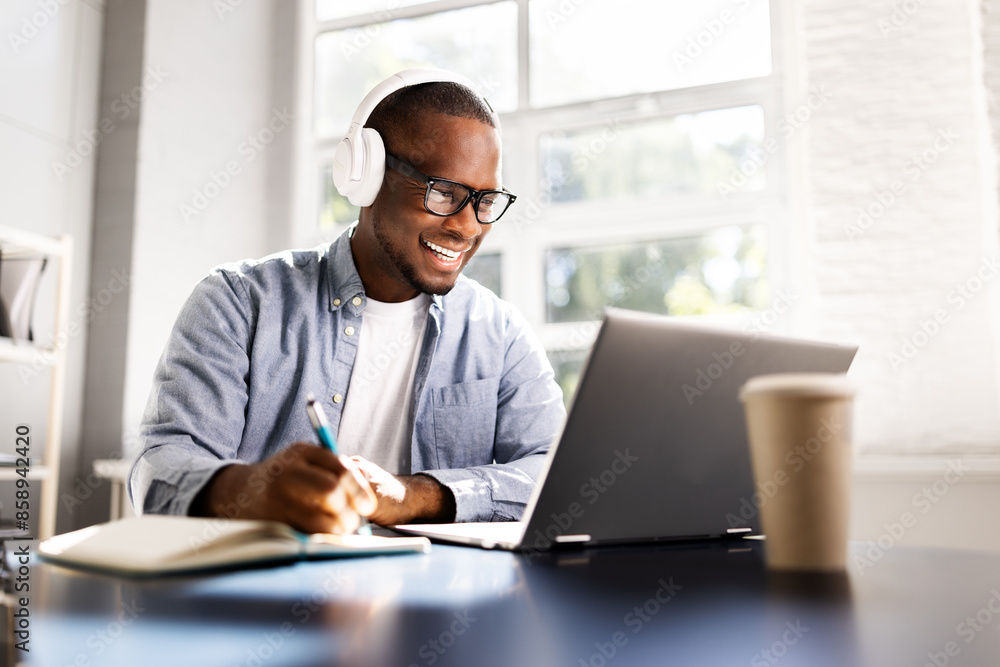 Fototapeta premium Virtual Learning: African American Male Student Excelling in Online Education