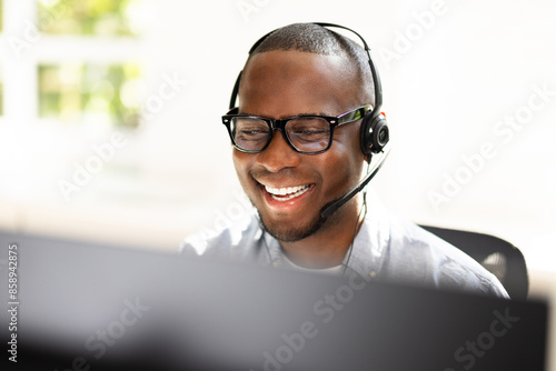 : Energetic Call Center Agent Ensuring Customer Satisfaction Over the Phone photo