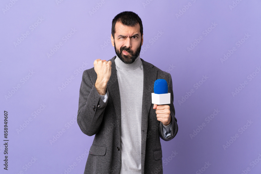 Adult reporter man with beard holding a microphone over isolated purple background with unhappy expression Adult reporter man with beard holding a microphone over isolated purple background with unhappy expression
