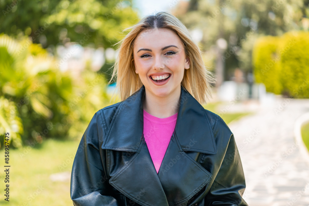 Young pretty blonde woman at outdoors With happy expression Young pretty blonde woman at outdoors With happy expression