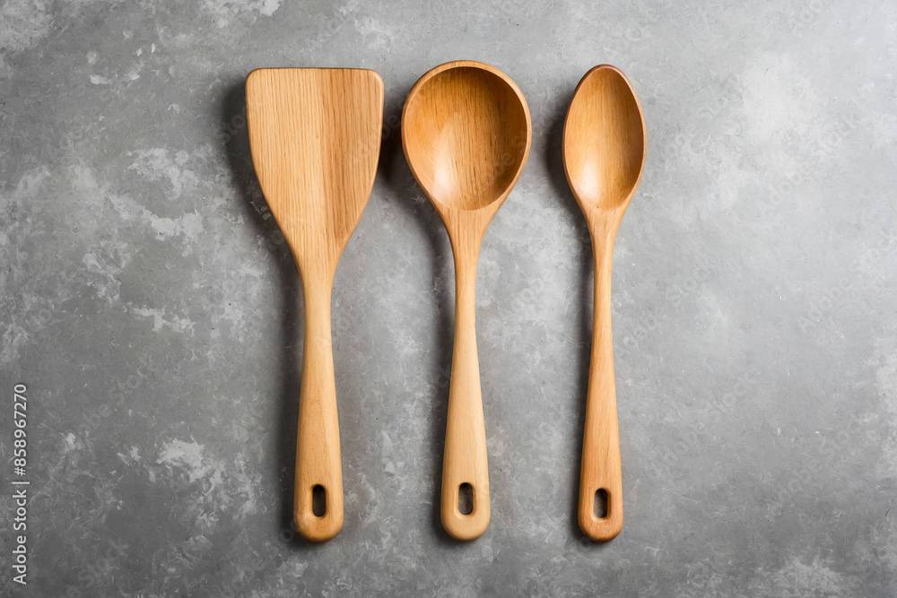 Wooden Cooking Utensils on Grey Background Wooden Cooking Utensils on Grey Background